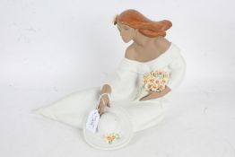 Large Lladro stoneware figurine, in the form of a seated lady holding flowers and a hat, with