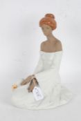Large Lladro stoneware figurine, in the form of a kneeling lady in white dress with hat, 32cm tall