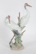 Lladro figure group, in the form of two cranes amongst reeds, 28cm tall