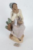 Lladro stoneware figurine 'Poetic Moment', the lady seated on a tree stump holding a book (book in