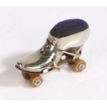 Silver plated novelty pincushion/ tape measure, modelled as a roller-skate, 7cm long