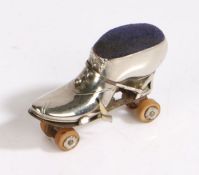 Silver plated novelty pincushion/ tape measure, modelled as a roller-skate, 7cm long