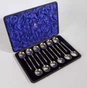 Set of twelve Victorian silver spoons, London 1871, maker Francis Higgins II, the terminals modelled