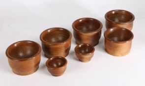 Collection of lignum vitae objects, to include string barrel, four balls, shallow bowl, two