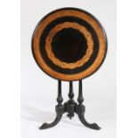 Victorian walnut, ebonised and marquetry inlaid tilt top occasional table, the circular top with