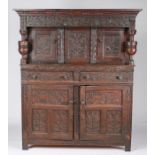 A late 17th century oak court cupboard, circa 1670 and later Having a gauge-carved cornice, and