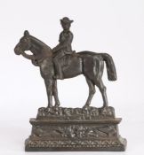 Cast iron "Dr Jim" doorstop, modelled as a figure on horseback above a crossed spear and scroll
