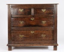 George III oak chest of two short and two long drawers, with brass swan neck handles, on reeded