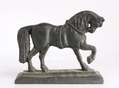 Cast iron doorstop, modelled as a horse with front hoof raised, 20cm wide, 24cm high