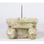 A limestone capital, converted to a sundial, probably 14th century Designed with corner animal