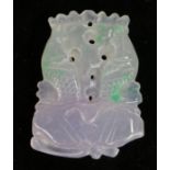 Jade pendant, carved as two leaping fish above a lotus leaf, 3.5cm wide, 5cm high