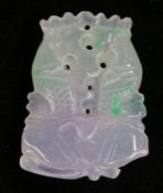 Jade pendant, carved as two leaping fish above a lotus leaf, 3.5cm wide, 5cm high