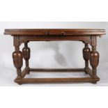 A mid-17th century oak draw-leaf table, Flemish, circa 1650 Having a fully cleated triple-boarded