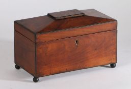 George III mahogany sarcophagus shaped tea caddy, with ebonised banding the lid opening to reveal