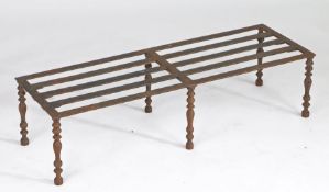 19th Century iron grate, the pierced slatted top raised on six cast baluster form legs, 91.5 wide,