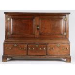 18th Century oak cupboard, with two panelled cupboard doors opening to reveal an interior shelf, the