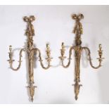 Pair of gilt decorated wall lights, the tied ribbon terminals above twin acanthus leaf decorated