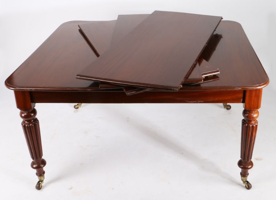Victorian mahogany dining table, the rectangular top with rounded corners and three additional - Image 2 of 3