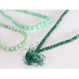 Three jade bead necklaces, to include two graduated examples, 37cm, 41cm, and 64cm long (3)