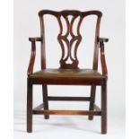 George III and later mahogany elbow chair, the swept acanthus leaf carved cresting rail above a
