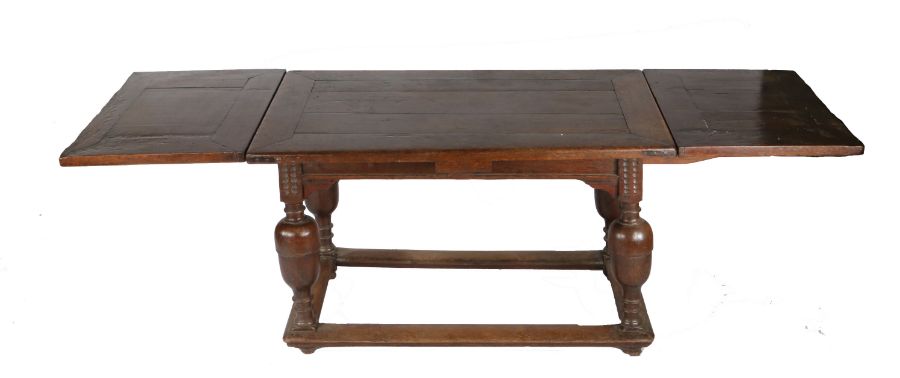 A mid-17th century oak draw-leaf table, Flemish, circa 1650 Having a fully cleated triple-boarded - Image 2 of 2