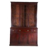 George III mahogany secretaire bookcase, the dentil pediment above a central sliding astragal glazed