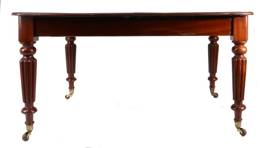 Victorian mahogany dining table, the rectangular top with rounded corners and three additional