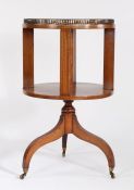 Edwardian mahogany inlaid circular revolving bookcase, with a brass gallery top above a central