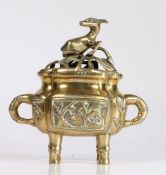 Chinese brass incense burner, the pierced lid decorated with a deer going down the body to two