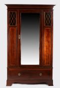 Edwardian mahogany and boxwood inlaid wardrobe, the moulded cornice above a single bevelled mirror