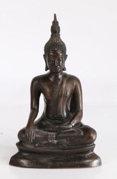 Cast bronze depiction of Buddha, modelled in a seated meditating position, 22cm high, 13.5cm high