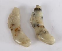 Pair of jade beads, modelled as wild boar laying, 6cm wide (2)
