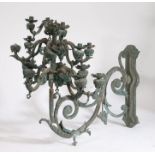 19th Century bronze wall mounted chandelier, of large proportions, the pierced scroll cast wall