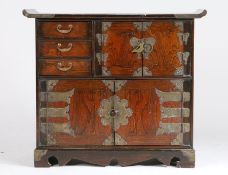 Chinese elm alter cabinet, with swept top above two cupboards and three small drawers, 70cm wide,