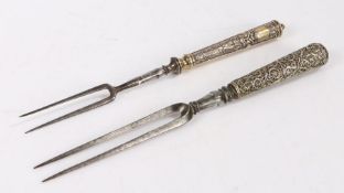 Two German two tined forks. circa 1700, the first with foliate and mask cast handle above a vacant