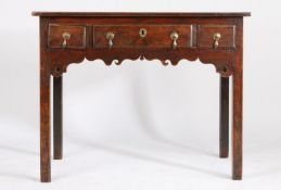 George III oak lowboy, with two short and one long drawer above a pierced carved apron, on square