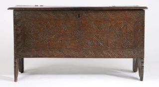 George III and later oak coffer, the scroll carved hinged lid above a foliate and scroll carved