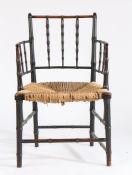 Morris & Co. style "Sussex" simulated bamboo elbow chair, the ebonised simulated bamboo frame with