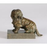 19th Century bronze inkwell, modelled as a seated shaggy dog, the hinged neck opening to reveal an