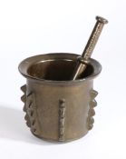17th Century Hispano Moresque pestle and mortar, the mortar body with cast geometric lugs, the