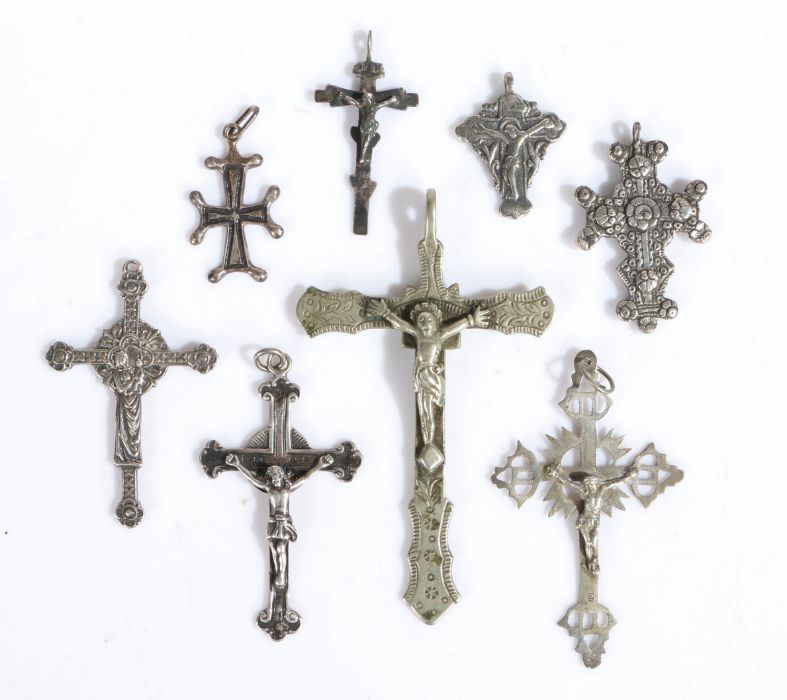 Collection of eight silver and white metal Corpus Christi and crosses one stamped 800, the largest