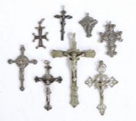 Collection of eight silver and white metal Corpus Christi and crosses one stamped 800, the largest