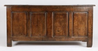 George II oak coffer, with plank lid above quadruple panelled front, raised on block feet, 170cm