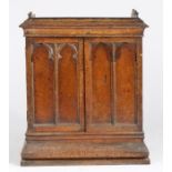 Gothic Revival oak two door cupboard, the doors and sides with Gothic style tracery, the doors