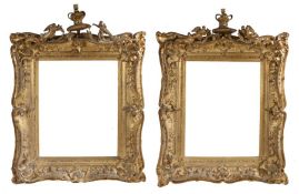 A fine pair of Victorian gilt gesso swept picture frames with crown finials flanked by angels 56 x