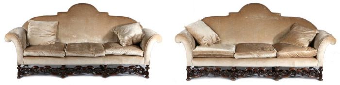 A good quality pair of William & Mary style settees, each settee with an arched stuff over