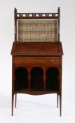 Attributed to Liberty & Co. Arts and Crafts 'Medina' walnut bureau bookcase of Moorish style,