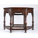A Charles II oak credence-type table, circa 1680 and later Having an octagonal fold-over top, the