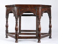 A Charles II oak credence-type table, circa 1680 and later Having an octagonal fold-over top, the