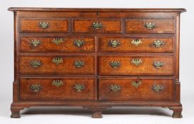 George III oak and mahogany banded mule chest, the hinged top above three simulated drawers and